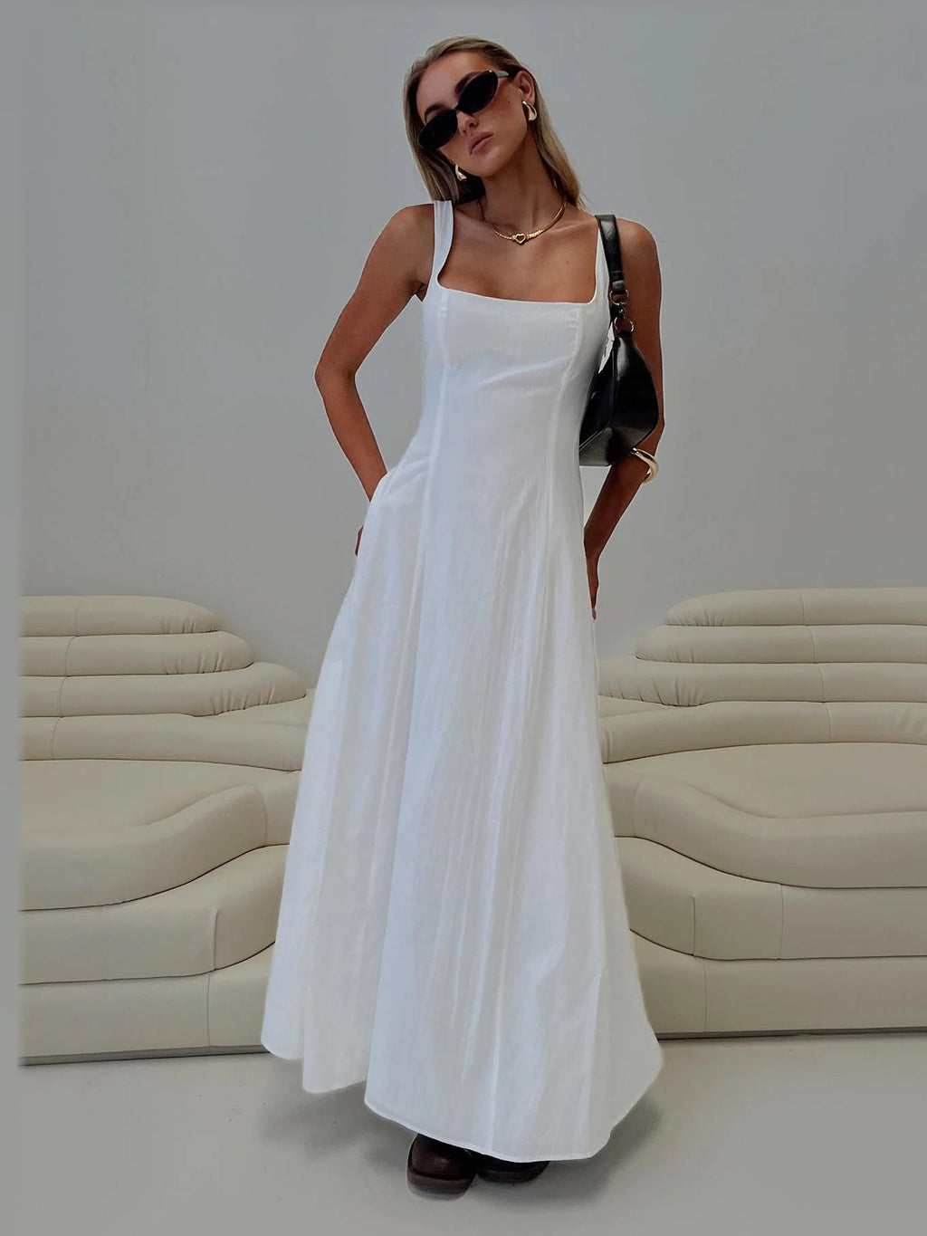 White formal dress with a-line silhouette and maxi length