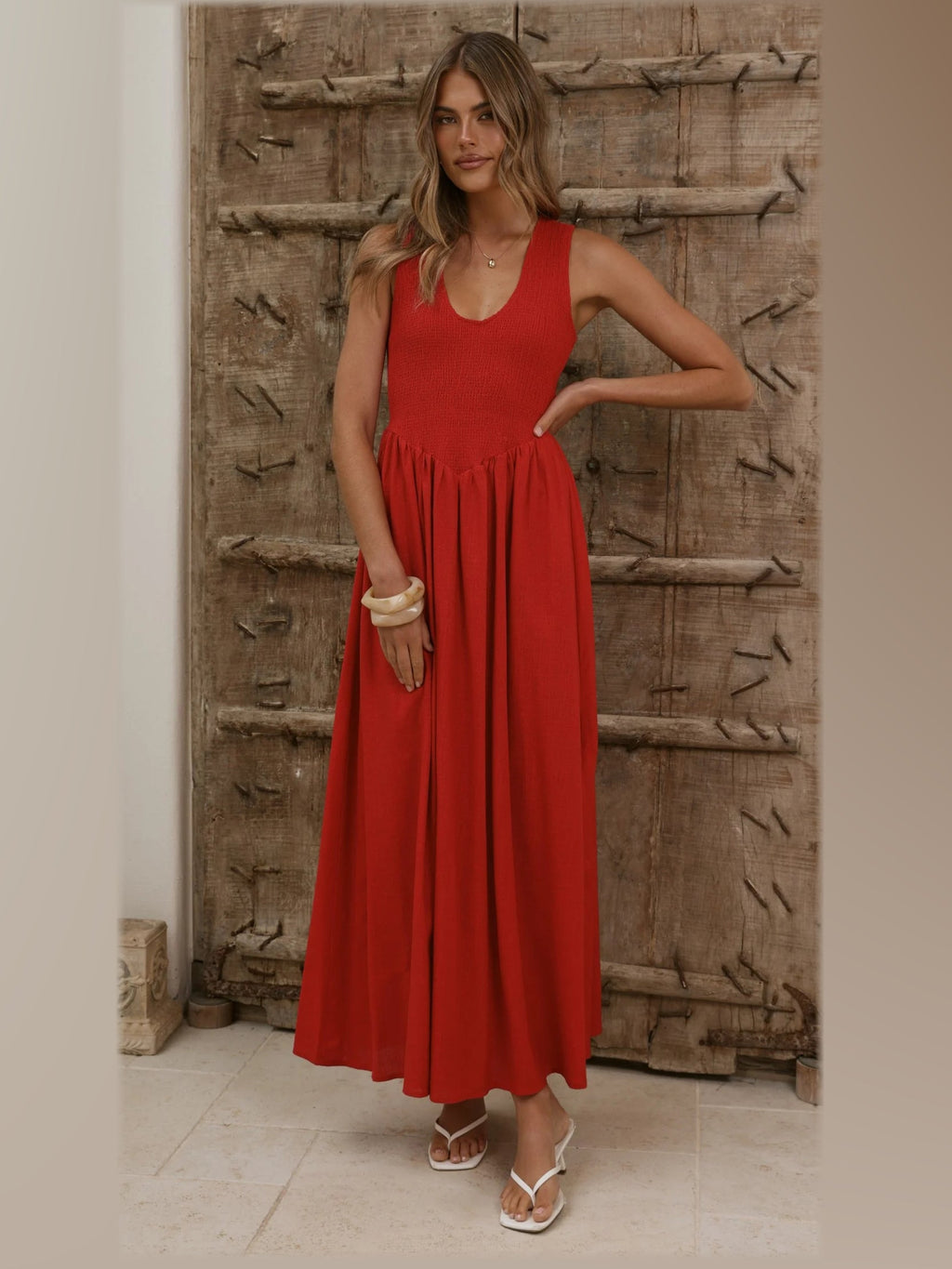 Red formal dress with a-line silhouette and maxi length
