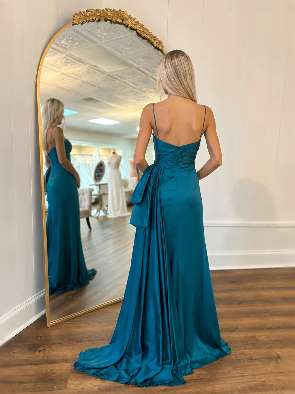 Teal floor-length prom dress, front view showing the a-line silhouette