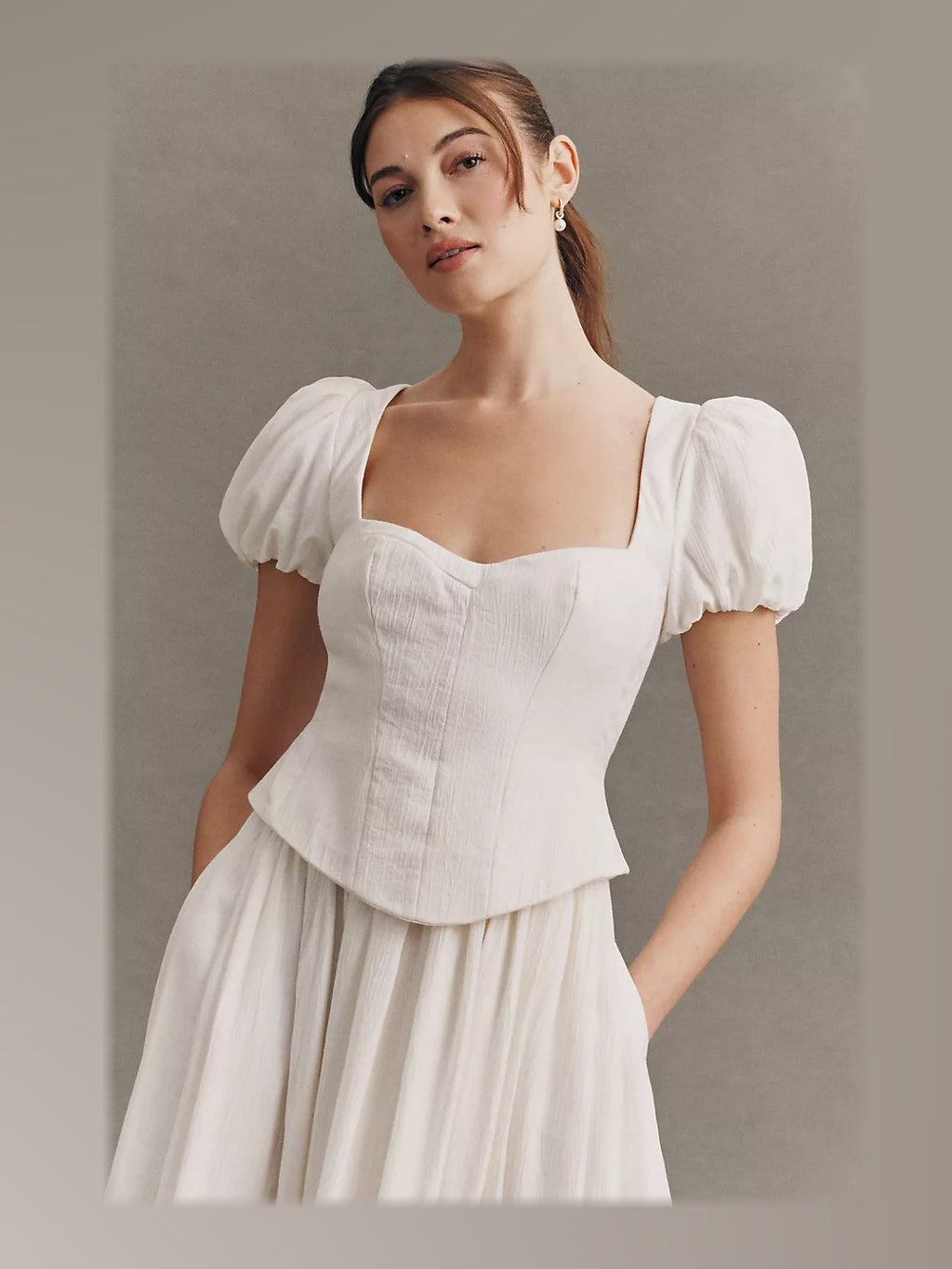 Ivory formal dress with structured woven fabric construction and maxi hem