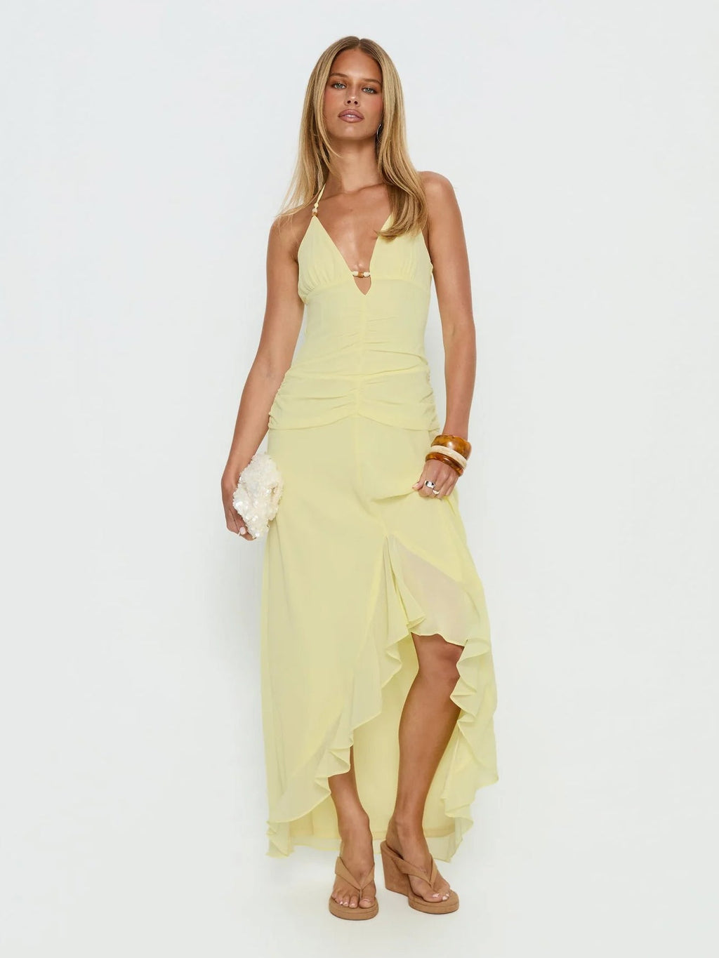 Yellow formal dress with structured woven fabric construction and maxi hem