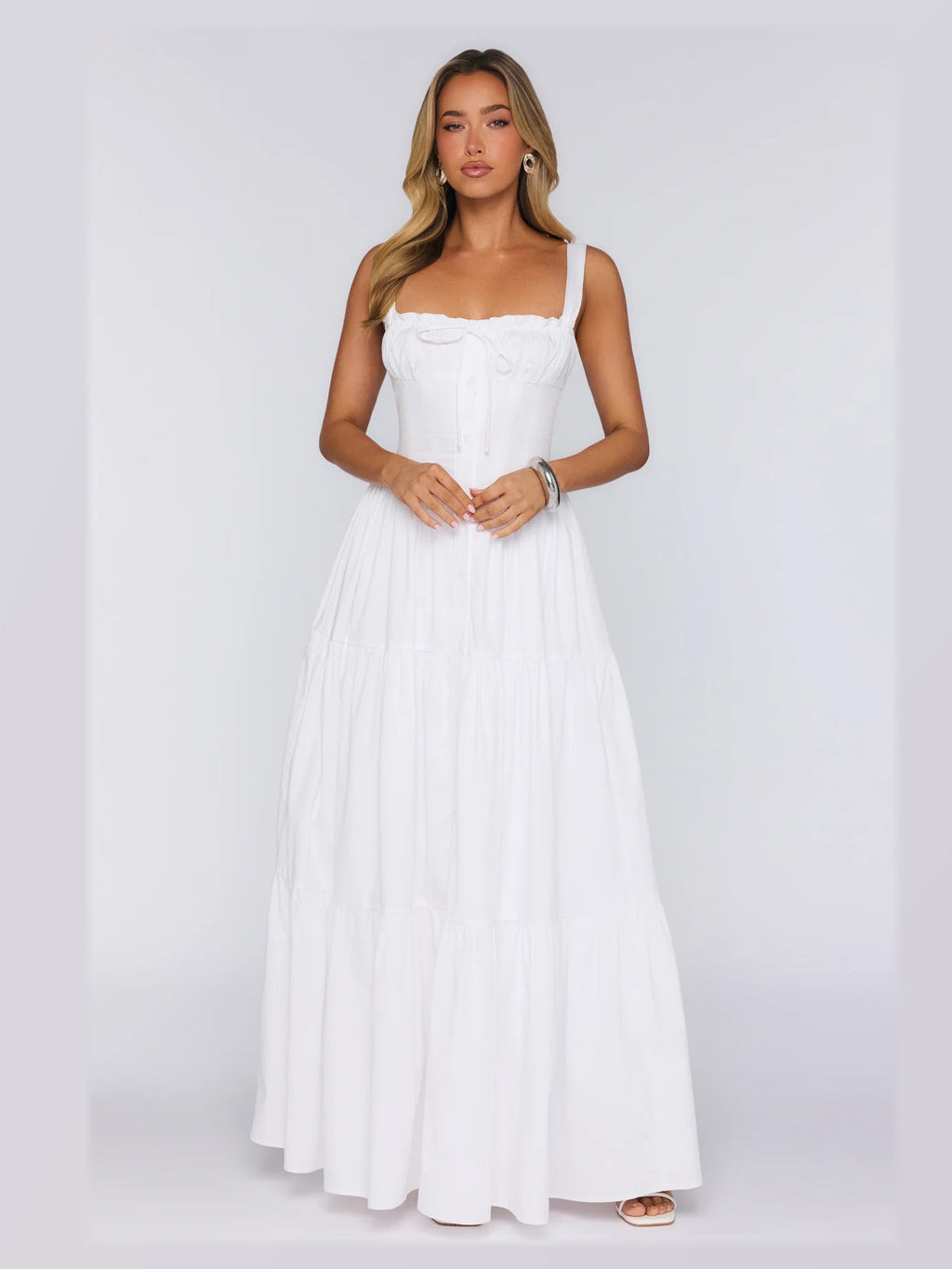 White formal dress with structured woven fabric construction and maxi hem
