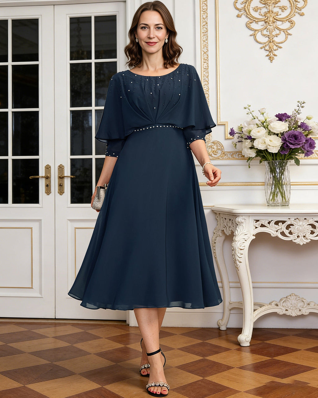 tea length chiffon mother of the bride dress with beaded cape overlay and A-line skirt