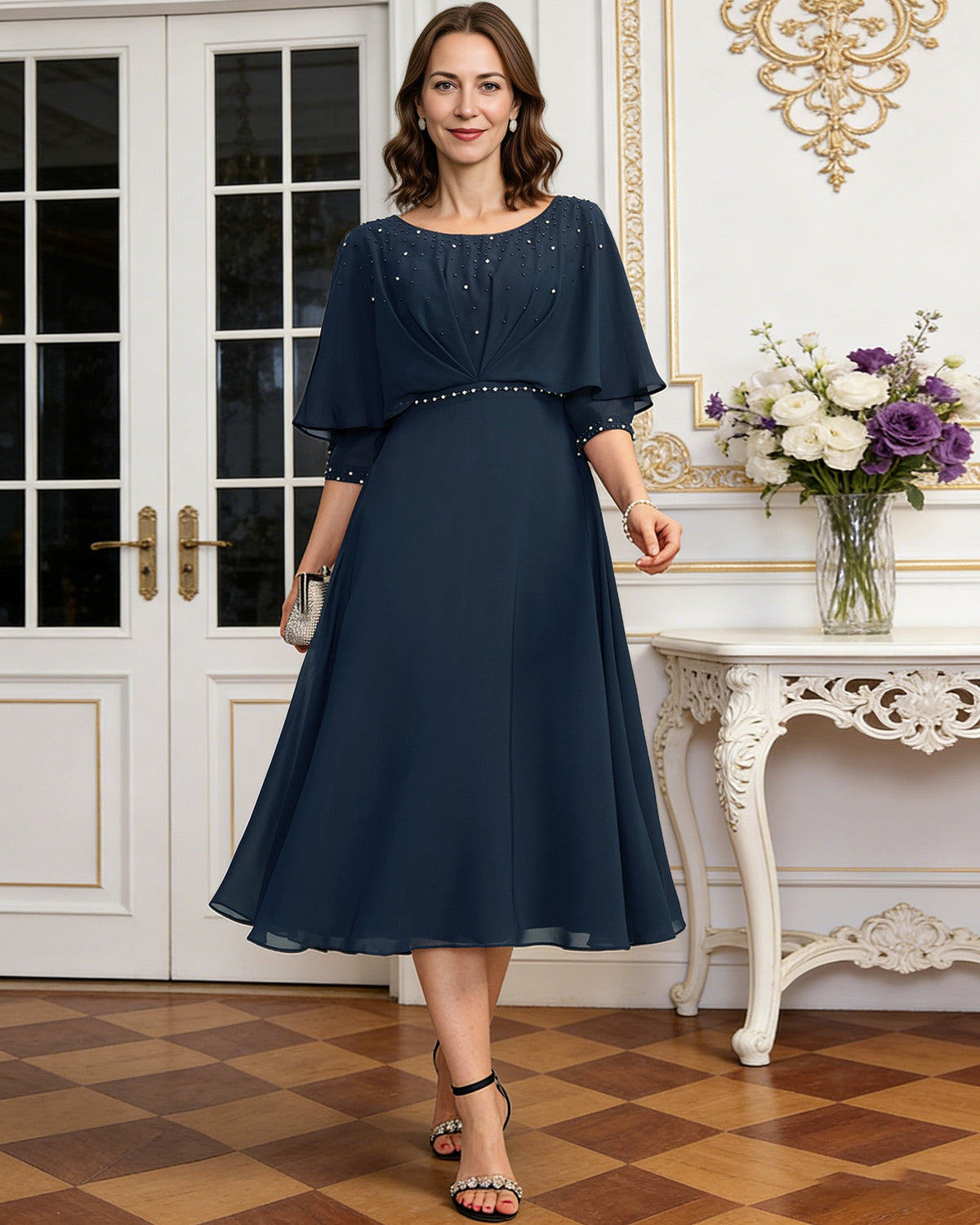 tea length chiffon mother of the bride dress with beaded cape overlay and A-line skirt