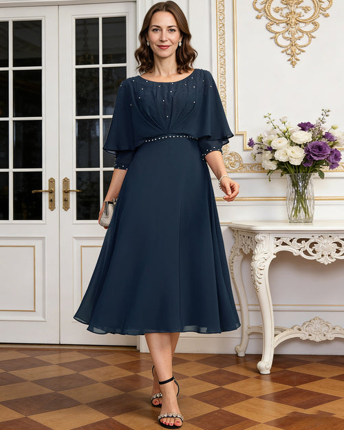 tea length chiffon mother of the bride dress with beaded cape overlay and A-line skirt