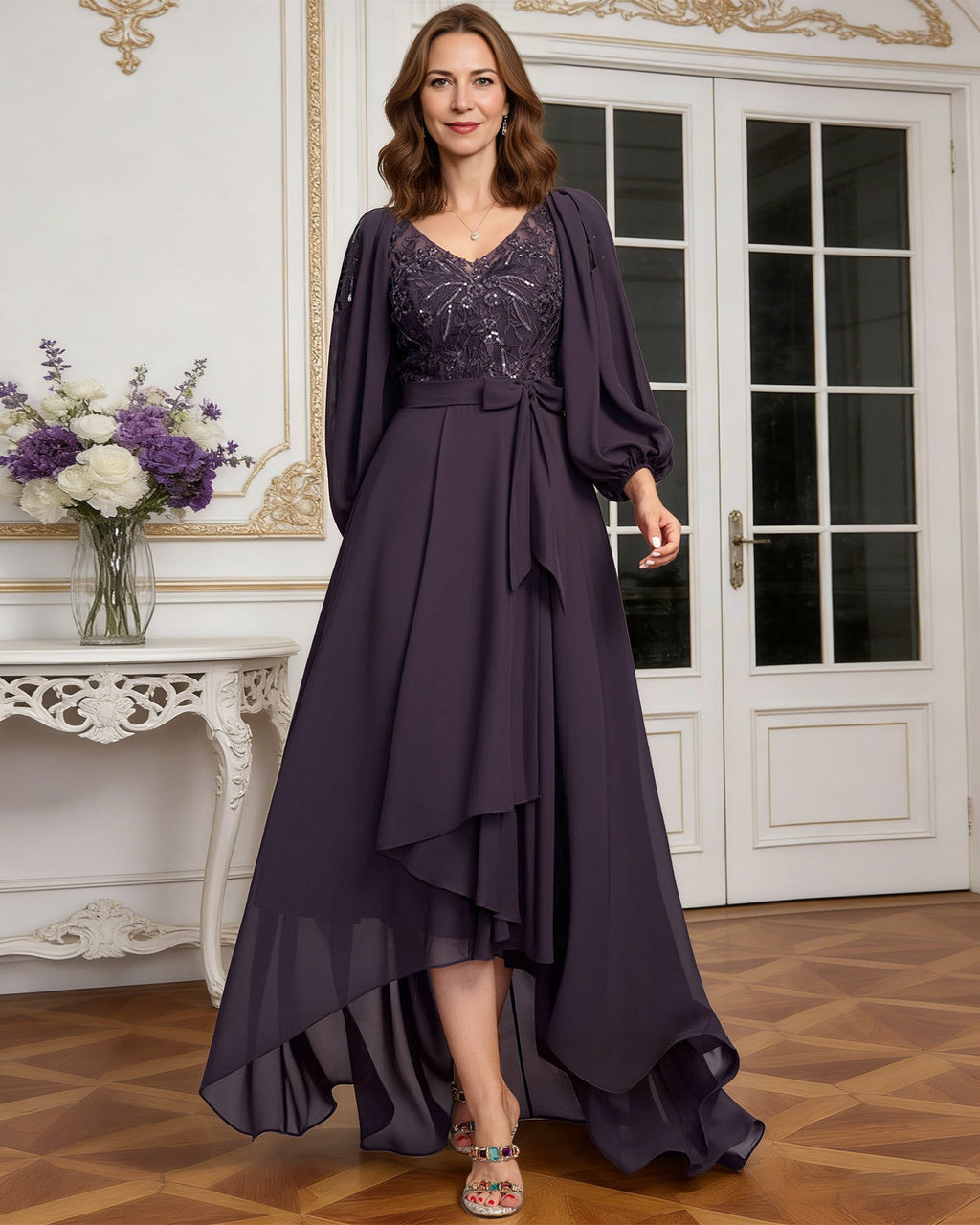 high low mother of the bride dress with lace bodice, chiffon jacket sleeves, tie waist, and layered skirt
