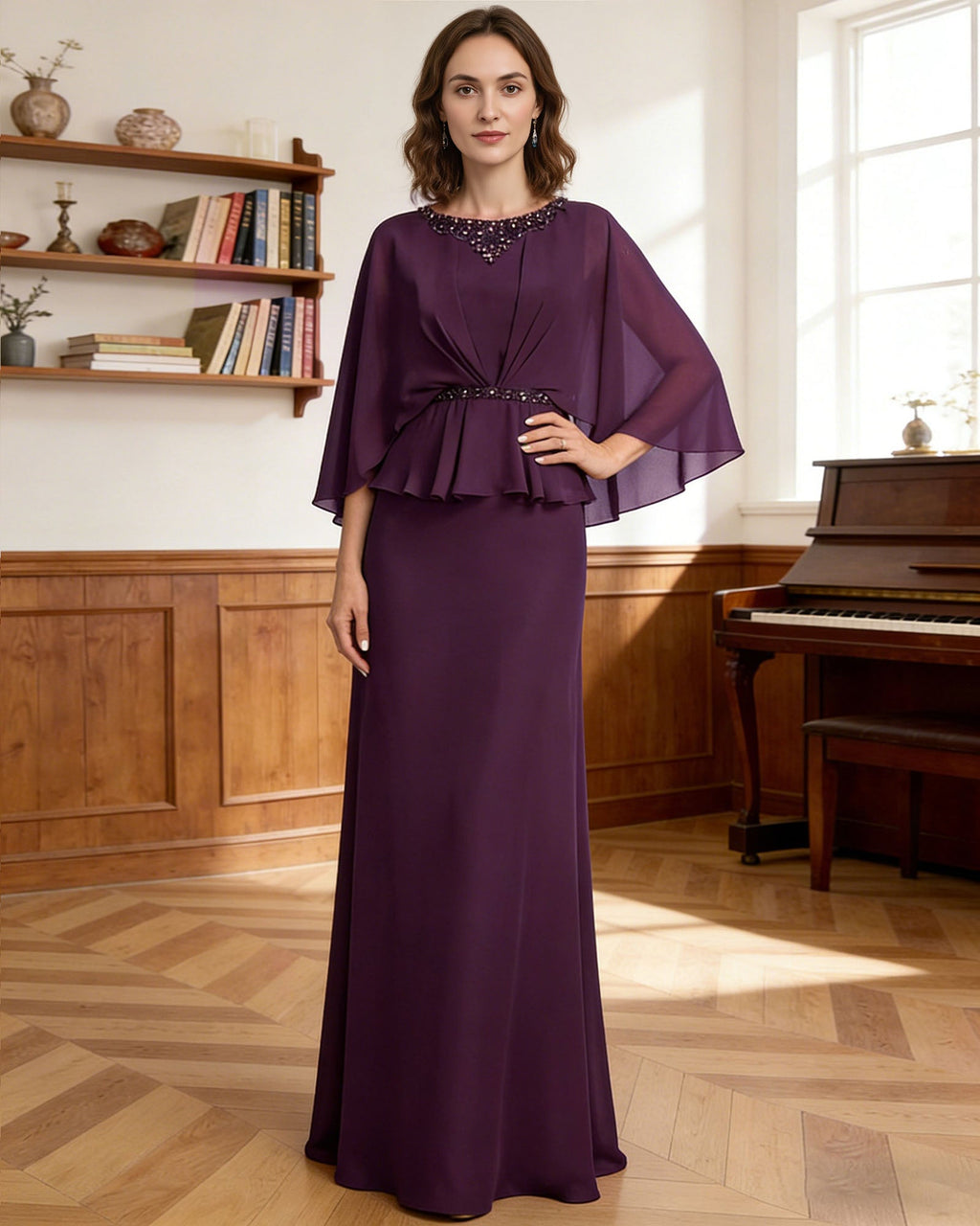 long capelet mother of the bride dress with beaded neckline, peplum overlay, and floor length chiffon skirt front detail highlighting neckline, sleeves, waist, and fabric